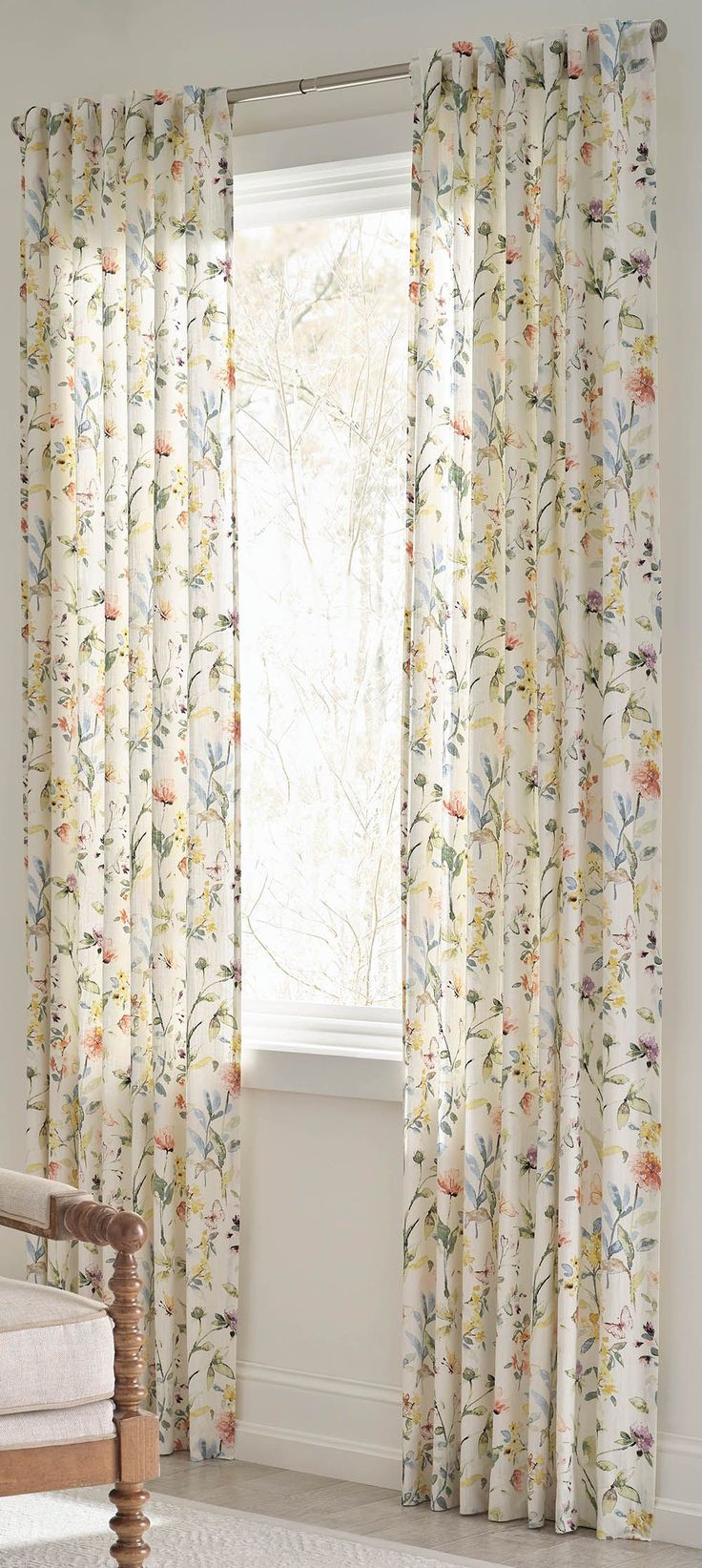 this picture contains a floral light fabric curtain 